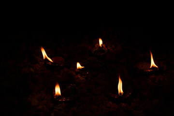 Floor decorated with diyas and flowers on the occasion of diwali