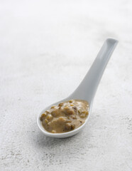 Mung beans porridge (bubur kacang hijau) is a Malaysian traditional dish usually eat as starter or desert. Made from mung beans, coconut milk & palm sugar. Isolated over wooden background