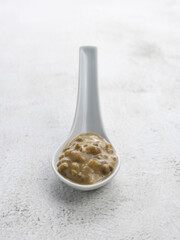 Mung beans porridge (bubur kacang hijau) is a Malaysian traditional dish usually eat as starter or desert. Made from mung beans, coconut milk & palm sugar. Isolated over wooden background