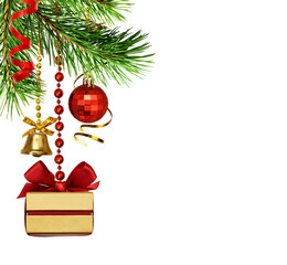 Hanging red and golden decorations on green fir twigs with present gift for Christmas isolated on white