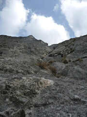 Climber at Kaiser Max via ferrata in Tyrol, Austria