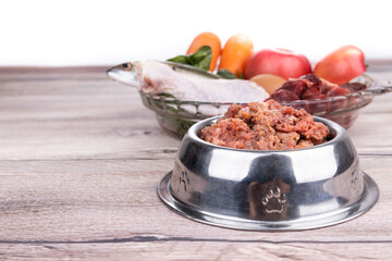 Minced barf raw food recipe ingredients for dogs consisting meat, organs, fish, eggs and vegetable