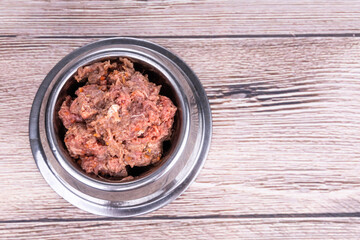 Serving of minced raw barf beef meat for dog meal