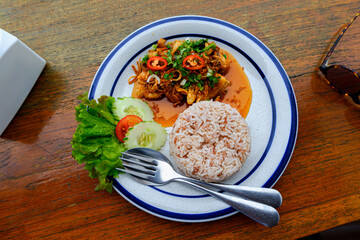 Seafood fried rice on table with spoon fork