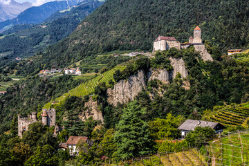 Fototapeta na wymiar The Brunnenburg castle and Tyrol Castle near Merano, South Tyrol in the town of Tirolo, Bolzano province, Italy.