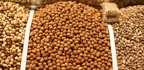 Oriental sweets assortment of fresh and healthy nuts and dried fruits on the market