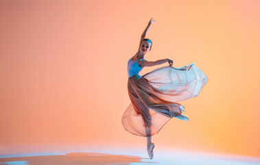 Ballerina in a light dress is dancing on colored background with backlight