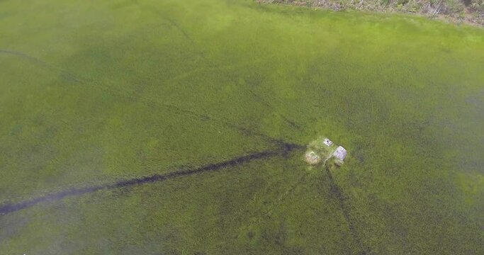 Ancient Archeological Ruins on Small Island in the Middle of Semi Dry Seasonal Lagoon shot from Above