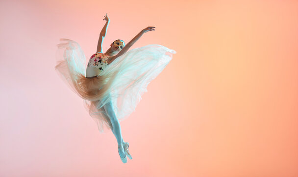 Ballerina in a light light dress flying in jump on an illuminated colored background - Powered by Adobe