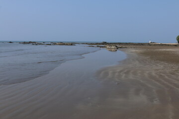 Christian cross on the seashore in Goa