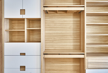 Modern wardrobe with slide out rack for coathangers. Detail of modern furniture