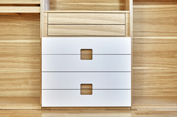 Modern wardrobe with finger pull design. Wooden wardrobe with light gray cabinet doors. Modern furniture
