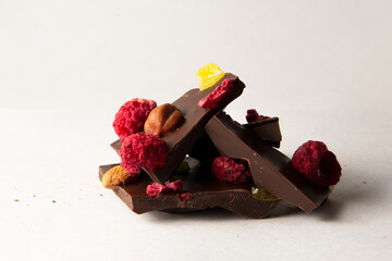 broken bitter chocolate with berries and marmalade