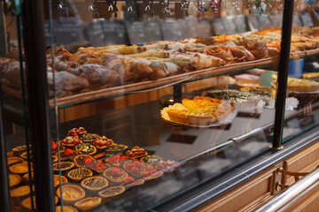 Retail display with freshly baked desserts for sale at local bakery