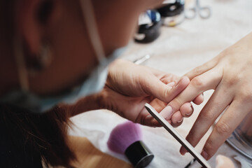 Manicure remove. filing nails. close-up top view