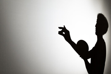 play shadow projected against a white background, a snail