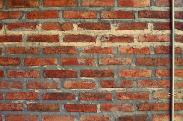 Fototapeta premium Old red brick wall texture grunge background with vignetted corners, may use to interior design