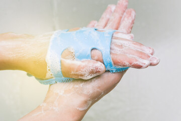 Washing hands with warm water, soap and a washcloth. Prevention of the coronavirus pandemic