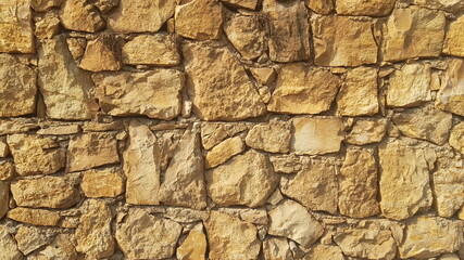 A  Yellow Stone Wall for Backgrounds Backdrops or Copy Space
