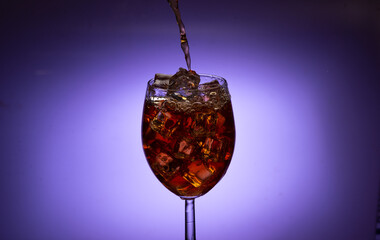 red wine pouring into glass