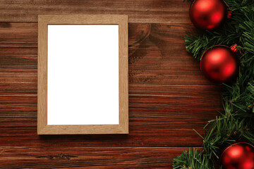 Merry christmas photo frame mockup template with pine leaves decorations.