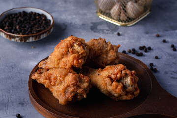 Fried chicken on a wooden board