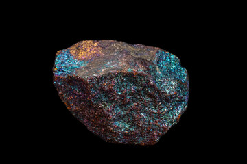 Natural stone, multicolored blue-green chalcopyrite on a back background.
