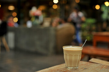 Cup of coffee on table in cafe - vintage style effect picture