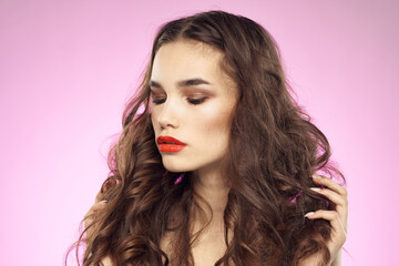 Woman with hairstyle and red lips naked shoulders bright makeup attractive look