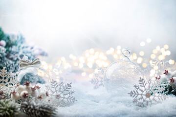 Christmas white decorations on snow with fir tree branches and christmas lights. Winter Decoration...