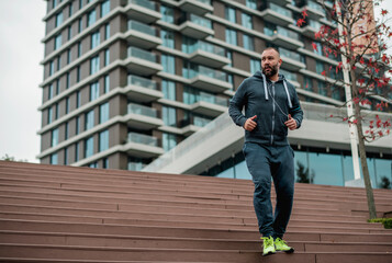 Young man jogging on stairs