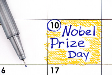 Reminder Nobel Prize Day in calendar with pen