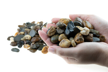 Stack fo rock from the river in lady hand isolated at white background