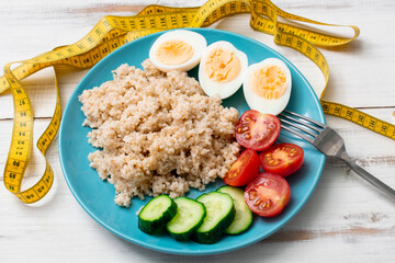 Diet and centimeter. Porridge on the water, chicken eggs. Healthy, proper nutrition.