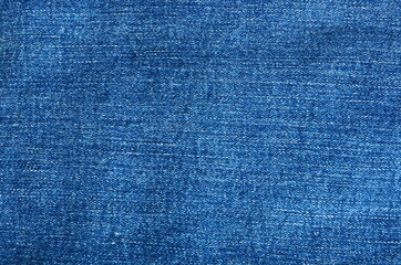 Texture of blue jeans fabric for background