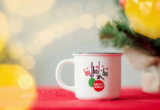 cup of coffee at Christmas time. New Year background. Bokeh of lights