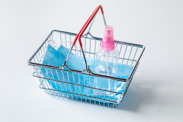 Medical mask and shopping basket during Coronavirus COVID-19 pandemic