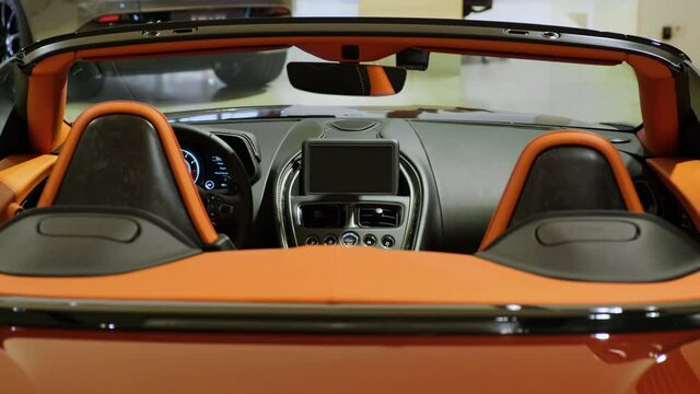 Panoramic back view of an passenger and drivers seat of modern sports convertible car