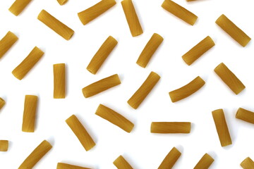 Texture of pasta in the form of pipes on a white background