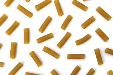 Texture of pasta in the form of pipes on a white background