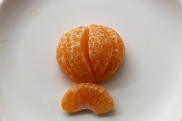 peeled tangerine on a plate