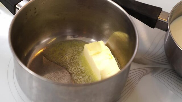in a saucepan on the stove melt butter for the preparation of bechamel sauce and other dishes. 