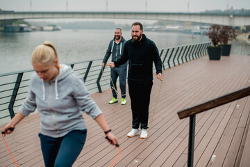 Group of friends doing fitness exercise outdoor