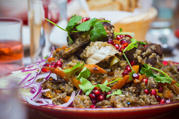 Served tasty meal with rice and meat close up view.