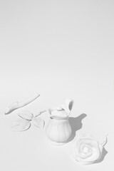 Minimal winter composition in isometric. Tea pot, brunch and white roses.  Frame mock up design. Still life art