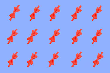 red bow pattern. red bow on a blue background. ribbon