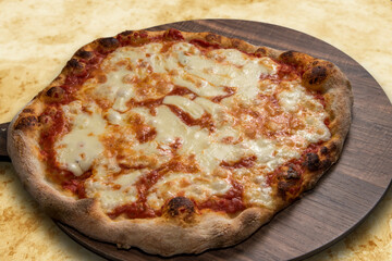 pizza whit tomato souce and mozzarella cheese on a wooden board