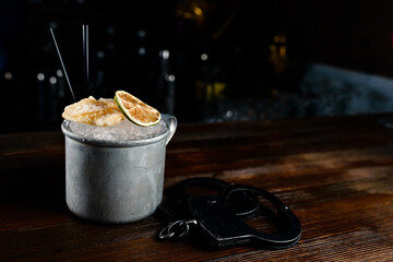 cocktail alcohol in a mug with ice, ginger and lime