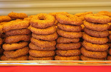 Stack of indian tasty pastries are displayed in a street vendor for sale. Indian food in Kuala Lumpur, Malaysia