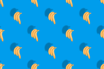 Seamless pattern of yellow bananas on a blue background.